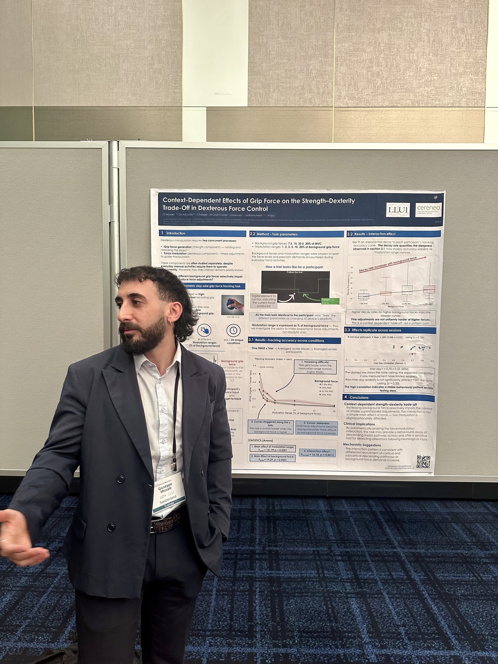 Giuseppe Missale presenting the MODUS poster at NCM 2026 in Kobe, with his conference badge visible.